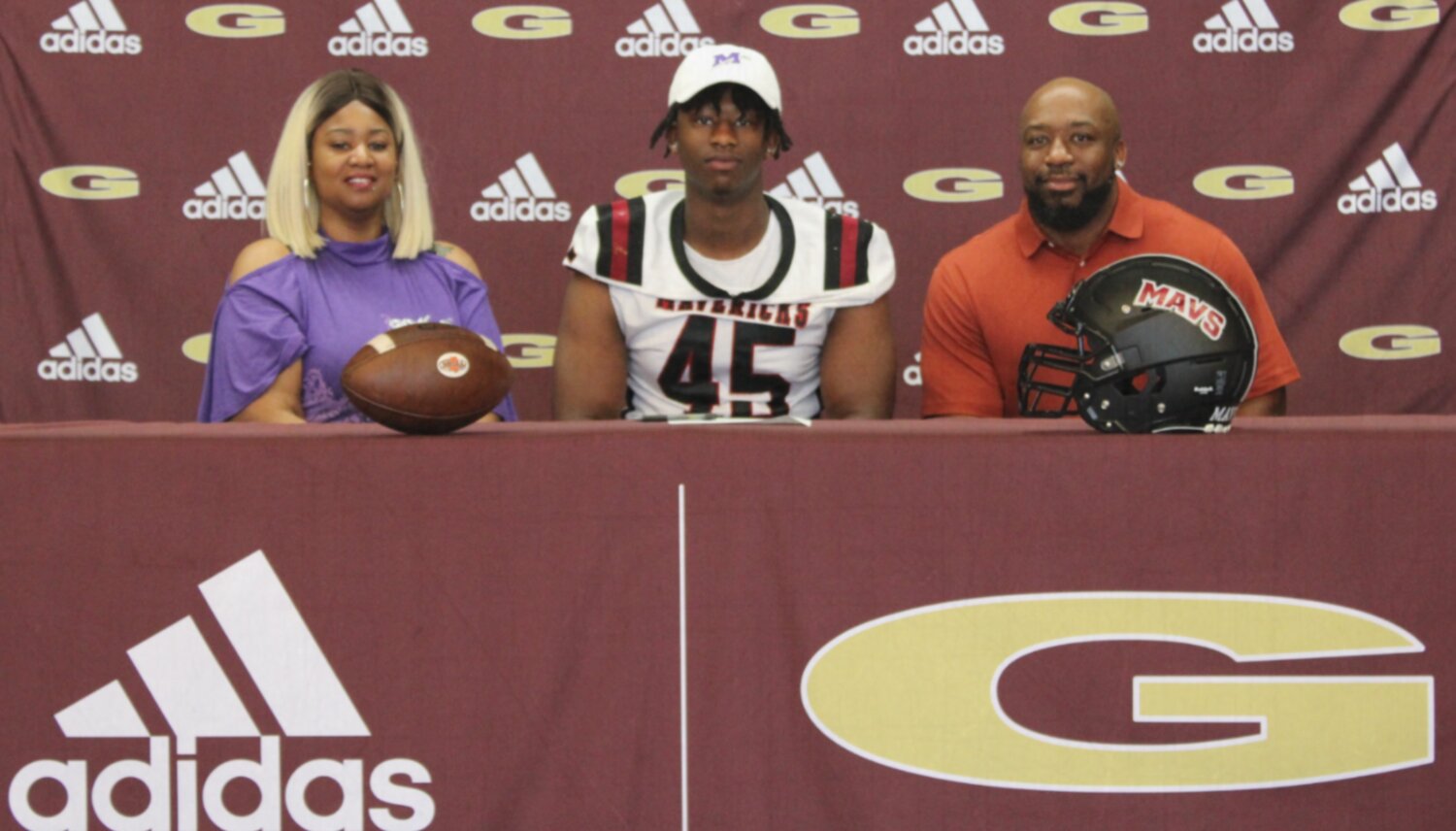 Senior, Demarcus Wright, signed to play football at Millsaps College. Pictured with Demarcus are his parents, DeMarcus Wright Sr. and Ronda Crump.